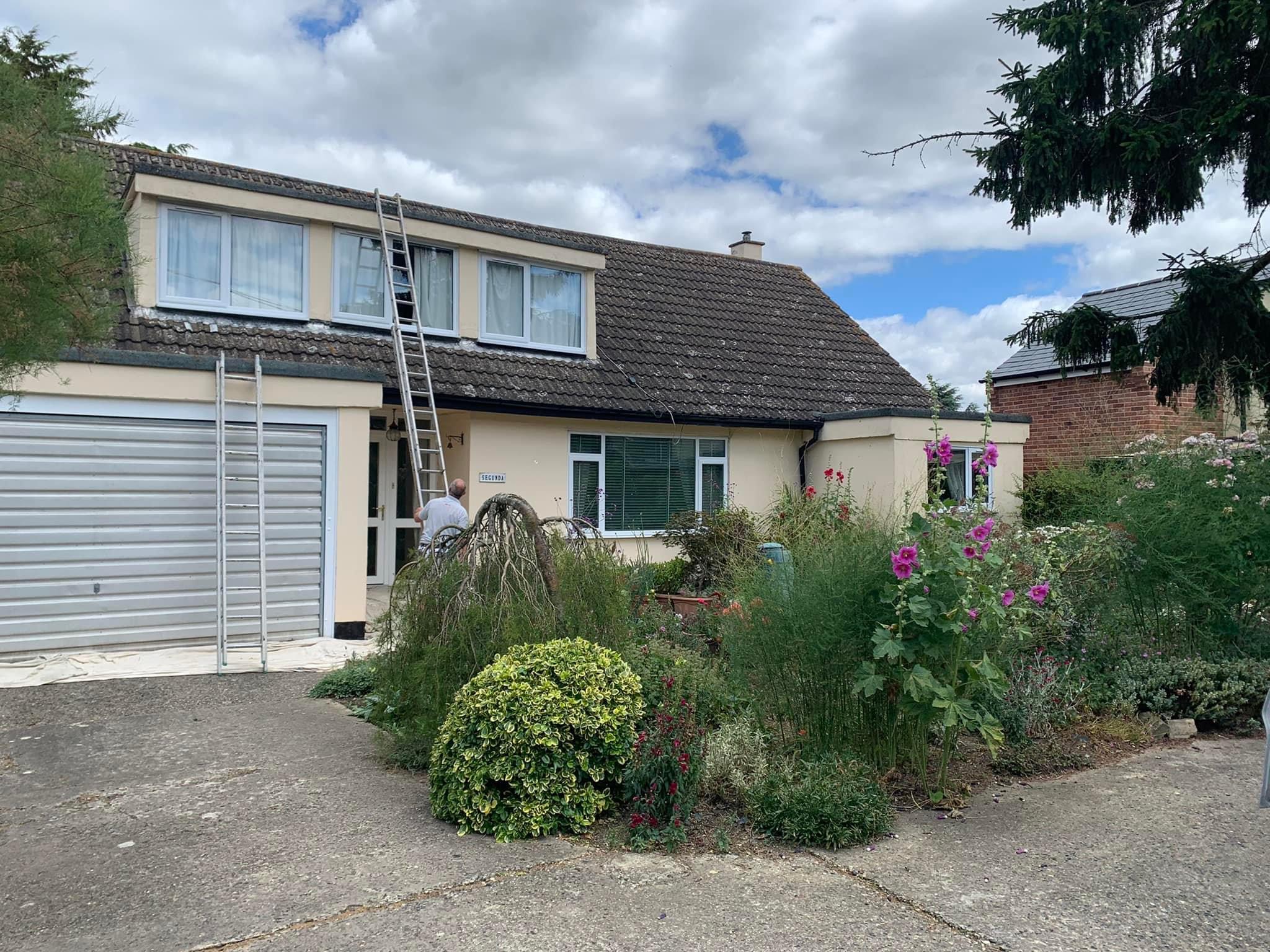 Chalet bungalow exterior during a repaint