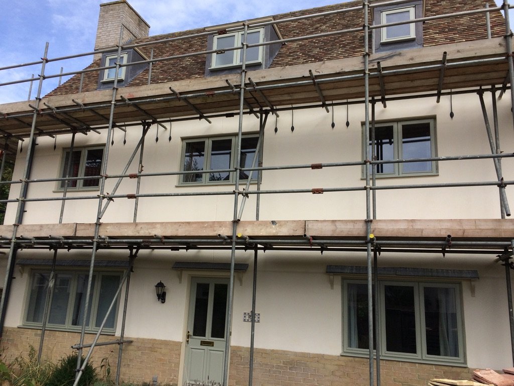 Terrace of houses under scaffold being repainted