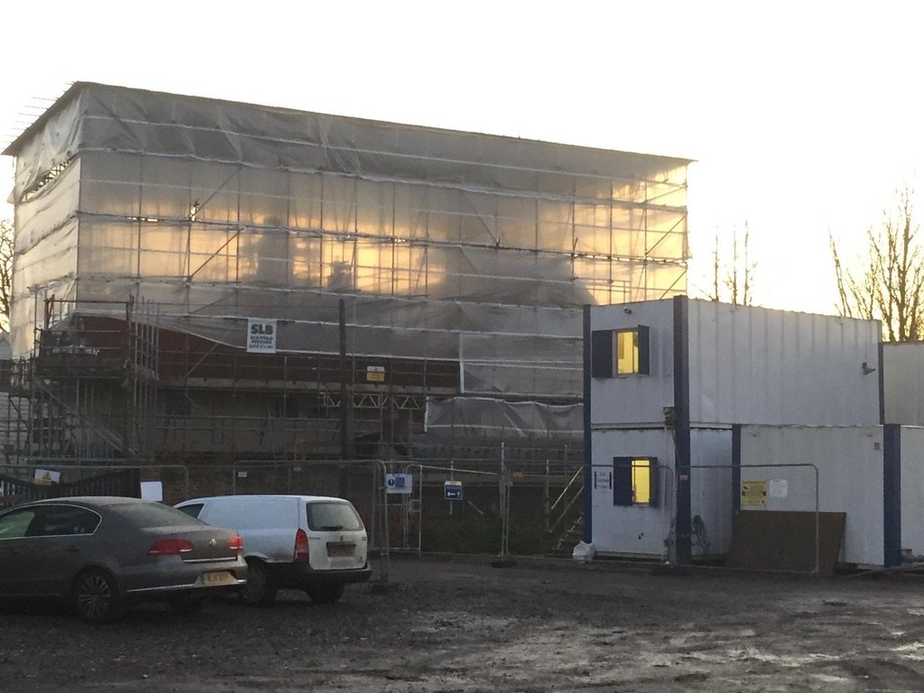 Commercial building wrapped in scaffolding